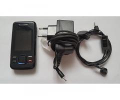Nokia 7100 Supernova (RM-438) s polnilcem in slušalko