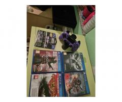 PS4 PRO 1TB + 2 polnilni postaji + kontrol freaks + 4 igre
