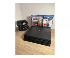 PlayStation 4 Pro 1TB + 2 kontrolerja + igre + polnilna postaja
